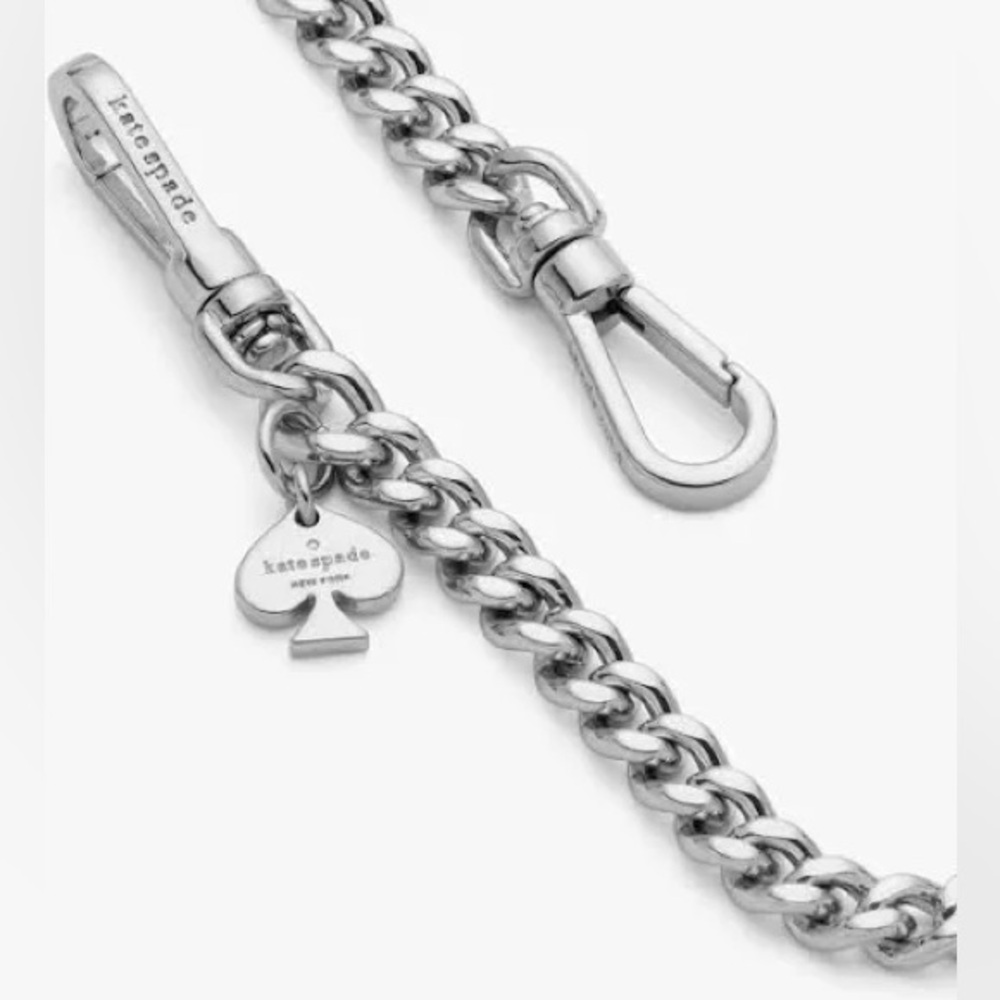 New with tag and in plastic. kate spade silver tone chain strap with spade charm